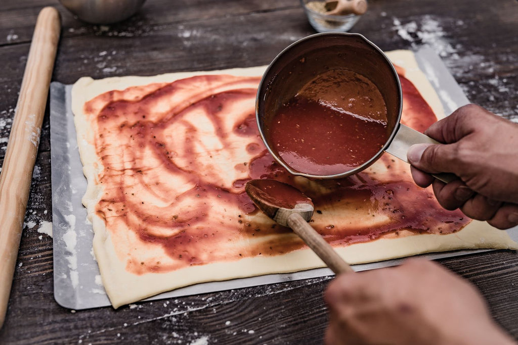 Pizzabrett rustfritt stål 40x30 cm rektangulært Grillfürst håndtak detalj