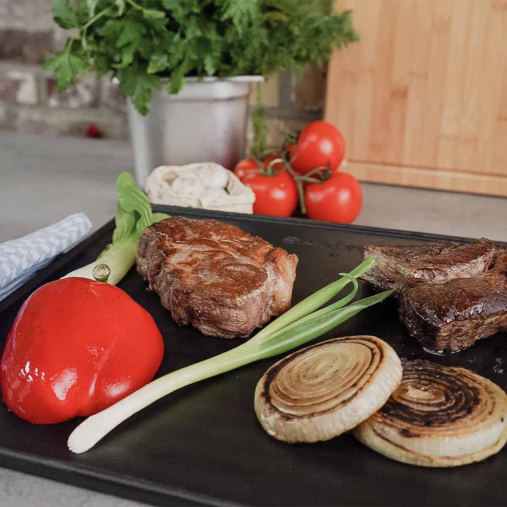 Nærbilde av ristet side på Vendbar grillplate støpejern for Broil King Baron/Crown 43,3x32 cm